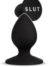 Cuneo anale in silicone nero con scritta "SLUT" bianca 6,3 x 3,5 cm.